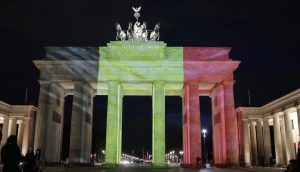 BrandenBUrg Gate in Berlin lit with the colours of the German Flag after a terrorist attack