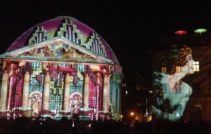 Colourful light display on St. Hedwigs Cathedral and the Hotel de Rome, Berlin